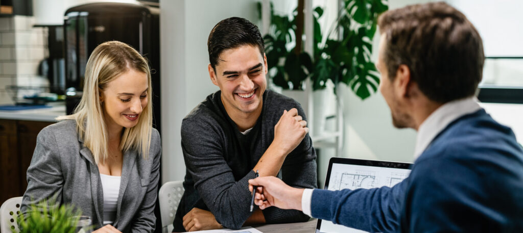 happy,couple,having,a,meeting,with,real,estate,agent,and